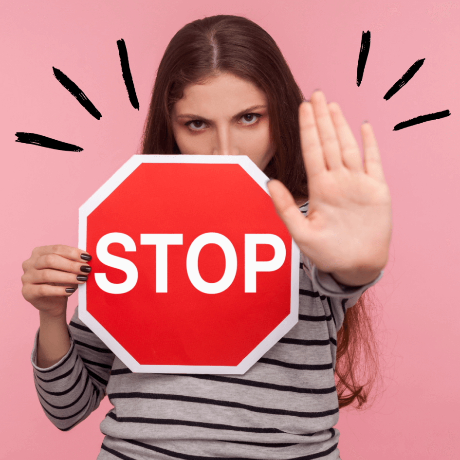 Image of a girl holding a stop sign.